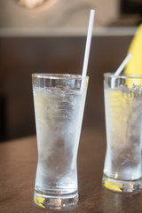 Glass of drinking ice water with ice cube