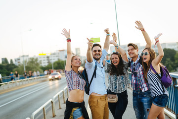 Fototapeta premium Happy young friends taking selfie on street