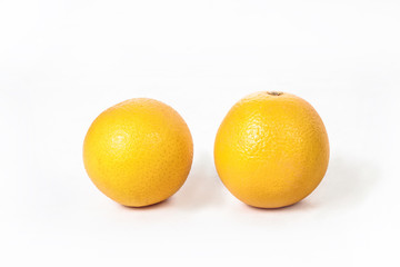 Juicy oranges on a white isolated background. Vegetarian food. Stock photo