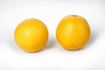 Juicy oranges on a white isolated background. Vegetarian food. Stock photo