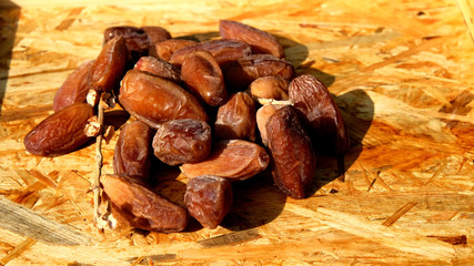 Dates in a wooden box under the afternoon sun