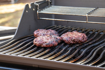 hamberger meat over the bbq grill