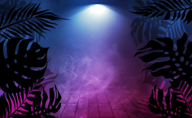Fototapeta na wymiar Background of empty dark scenes with neon lights and shapes, smoke. Silhouettes of tropical leaves in the foreground