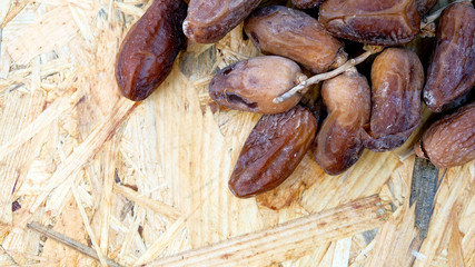 Dates in a wooden box under the afternoon sun