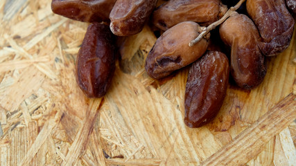 Dates in a wooden box under the afternoon sun