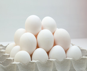 Chicken eggs. Concept for poultry farm, production of eggs for shops. Healthy foods and farming. Eggs in cells box.