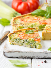 Quiche with vegetables (squash, tomatoes, cheese, herbs, green onions), open tart, French cuisine, traditional pastries