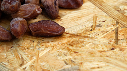 Dates in a wooden box under the afternoon sun