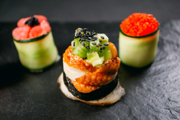 Seafood delicatessen sushi rolls on slate. Different gourmet snacks. Luxury lifestyle, Japanese food art, expensive meals, restaurant menu