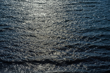 Sea surface as natural background, color toned.