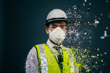 Confident expression of young supervisor or engineer wearing white helmet and face mask dispersing into pixels effect - 266347233