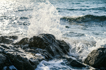 Waves at the seashore. Selective focus with shallow depth of field.