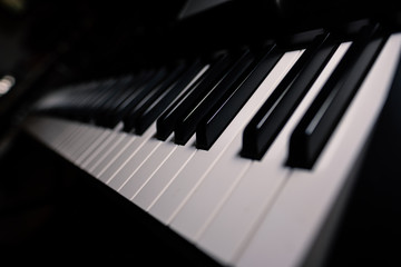Fototapeta premium keys on piano keyboard soundclassical grand harmony composer black musical enterteinment instrument melody closeup ebony organ grand jazz blues ivory studio rehersal ambient session recording
