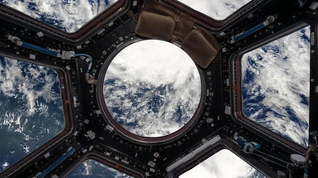 view from the porthole of the space station on planet earth