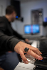 man playing a piano in a studio recording keys hand human form stage string keyboard synt creation art sound lesson teach course class info know chord melody rhythm - obrazy, fototapety, plakaty