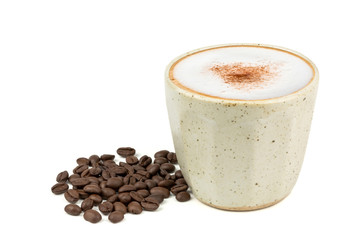 Side view of Hot cappuccino coffee in a vintage cup and roasted coffee beans isolated on white background. (Image stacking technique)