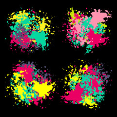Set of color spots made by ink or paint on the black background. Grunge abstract design elements, vector illustration EPS 10.