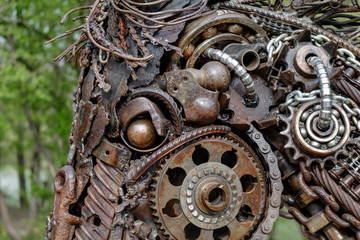 Fototapeta na wymiar figures from scrap metal and spare parts of machines and mechanisms