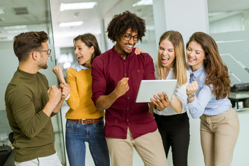 Multiracial businesspeople standing and disscusing in modern office