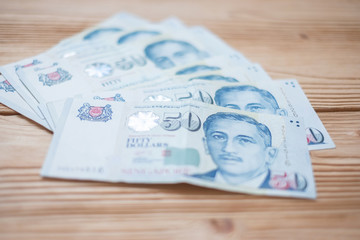 Fifty Singapore Dollars banknote. business, investment, retirement planning, finance and Saving for the future concepts