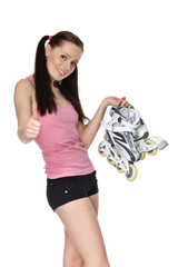 Young  sporty woman with rollerskates.