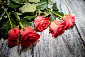 bouquet of roses on wooden background