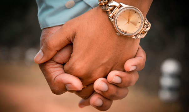 Couples, men, women holding hands together looking happy and loving each other Romantic atmosphere. Love pictures of Valentine's Day by touching the hand or wedding day.