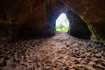 sandstone cave entrance in dark