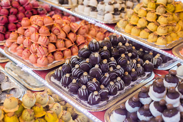 Marсipan store in Budapest. A counter with delicious sweets. Multi-colored marzipans
