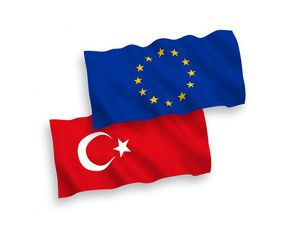 National vector fabric wave flags of Turkey and European Union isolated on white background. 1 to 2 proportion.