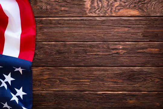 Flag of the United States of America on wooden background. Veterans USA Holiday, Memorial, Independence. - Image
