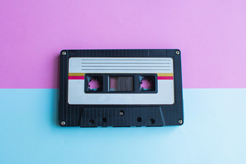Obraz premium retro of tape cassette on blue and pink background. soft focus.