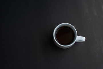 cup of coffee on black background. soft focus.