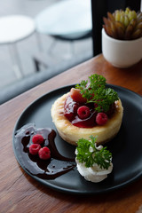 Homemade cheesecake with fresh berries and mint for dessert - healthy organic summer dessert pie cheesecake