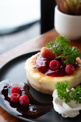 Homemade cheesecake with fresh berries and mint for dessert - healthy organic summer dessert pie cheesecake