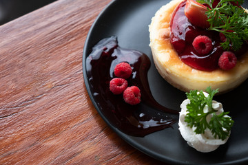 Homemade cheesecake with fresh berries and mint for dessert - healthy organic summer dessert pie cheesecake