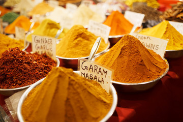 Colorful spices in bags at a market in Goa