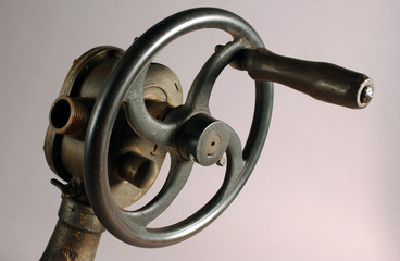 Antique hydraulic gate of rusty metal.