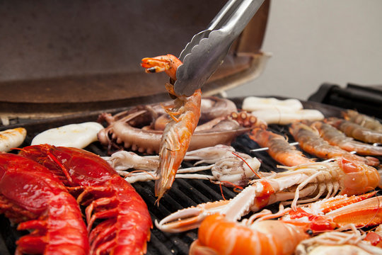 Whole Prawn being taken off the BBQ