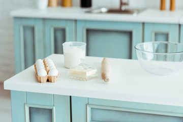 bakery ingredients with cooking utensils on table