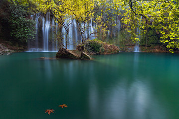 Stunning waterfalls with small emerald lake in deep green forest in Kursunlu Natural Park, Antalya, Turkey