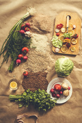 Organic food background with cutting board and lemon slices