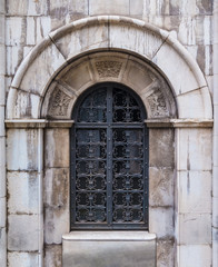 The wrought door of the stone crypt on the Montjuic Cemetery closeup front view, Barcelona, Catalonia, Spain