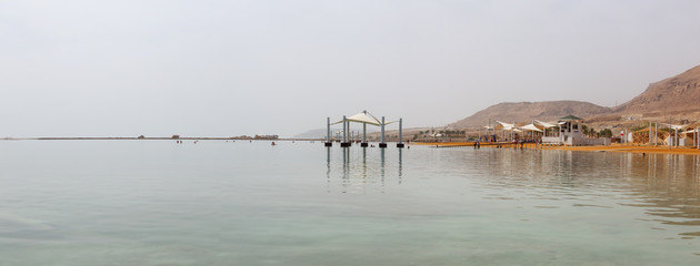 Panoramic view of the sandy beach near the Vacation Resorts at the Dead Sea. Taken in Ein Bokek, Israel.