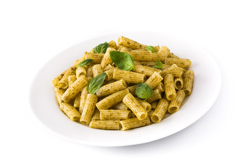 Penne pasta with pesto sauce and basil on a plate, isolated on white background