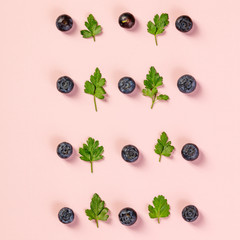 Pattern of blueberry and parsley leaves, flat lay, top view