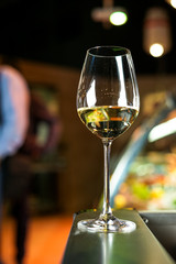 glasses of white wine on table in restaurant