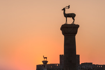 sunrise in Mandraki harbor. Rhodes, Greece