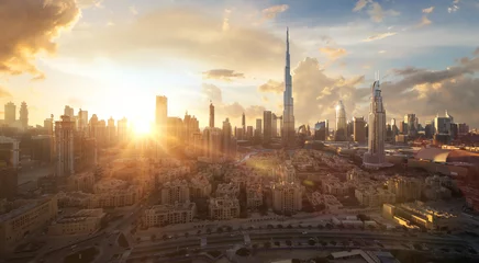 Foto op Canvas Skyline of Dubai Downtown at sunset with a dramatic sky © Cara-Foto