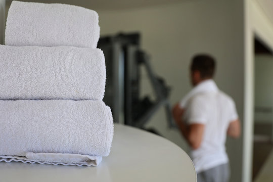 Gym Cleaning And Hygiene Concept. Stack Of White Clean Towels